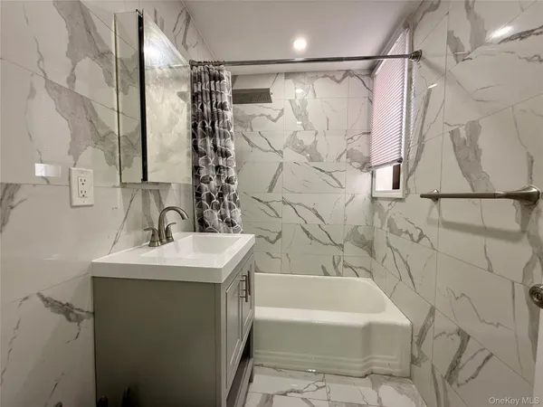 a bathroom with a sink and a bathtub