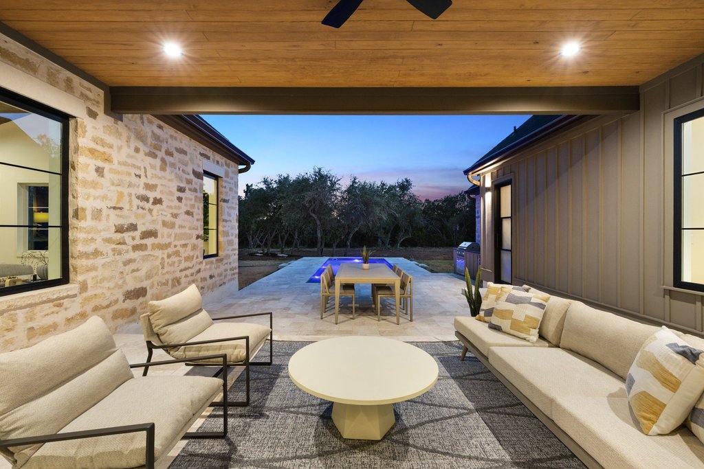9207 Zyle Road Austin, TX 78737 - Photo 32 of 40 An inviting covered patio seamlessly blends indoor comfort with outdoor leisure by the pool.