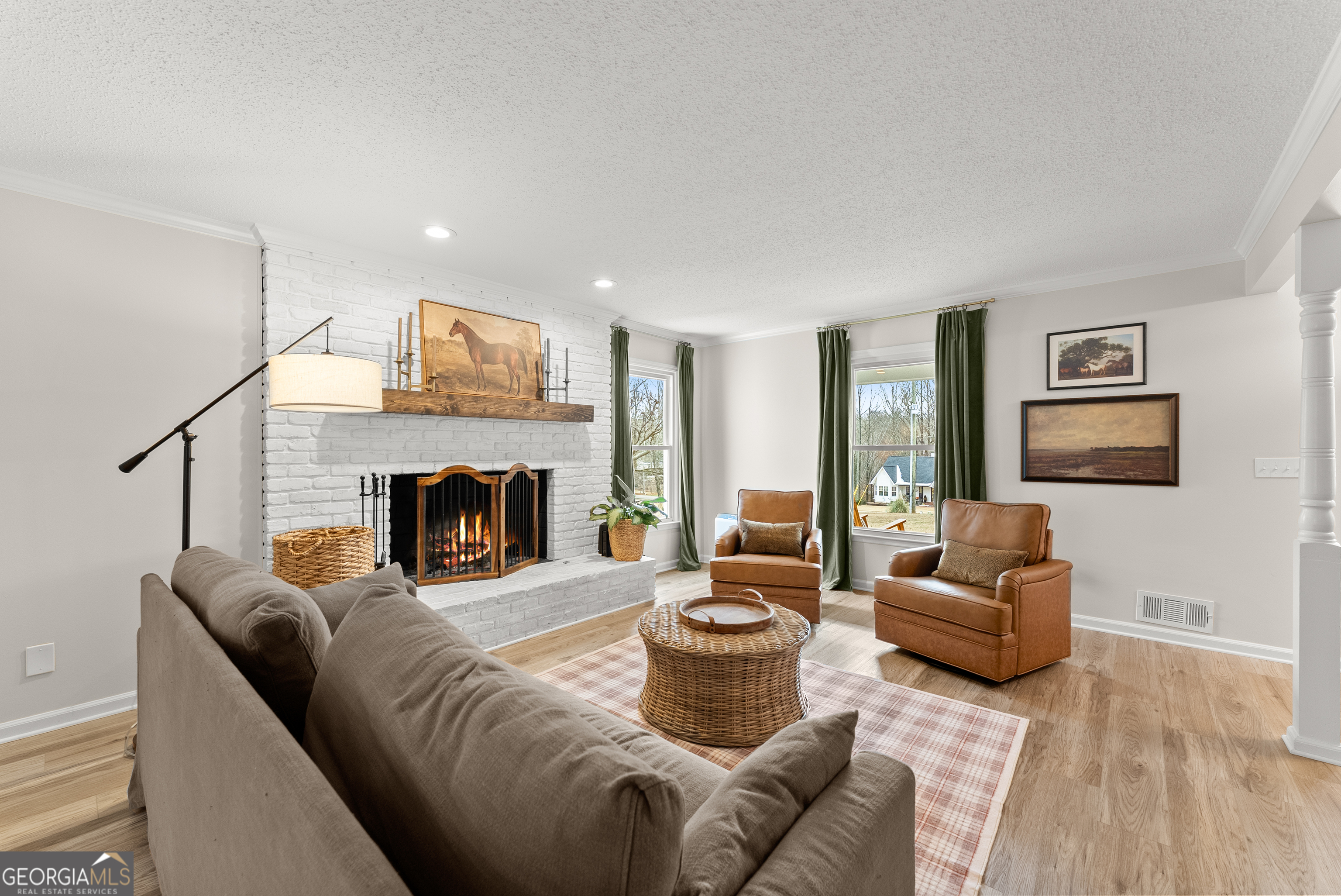 1165 Antioch Campground Road Gainesville, GA 30506 - Photo 11 of 65 a living room with furniture and a fireplace