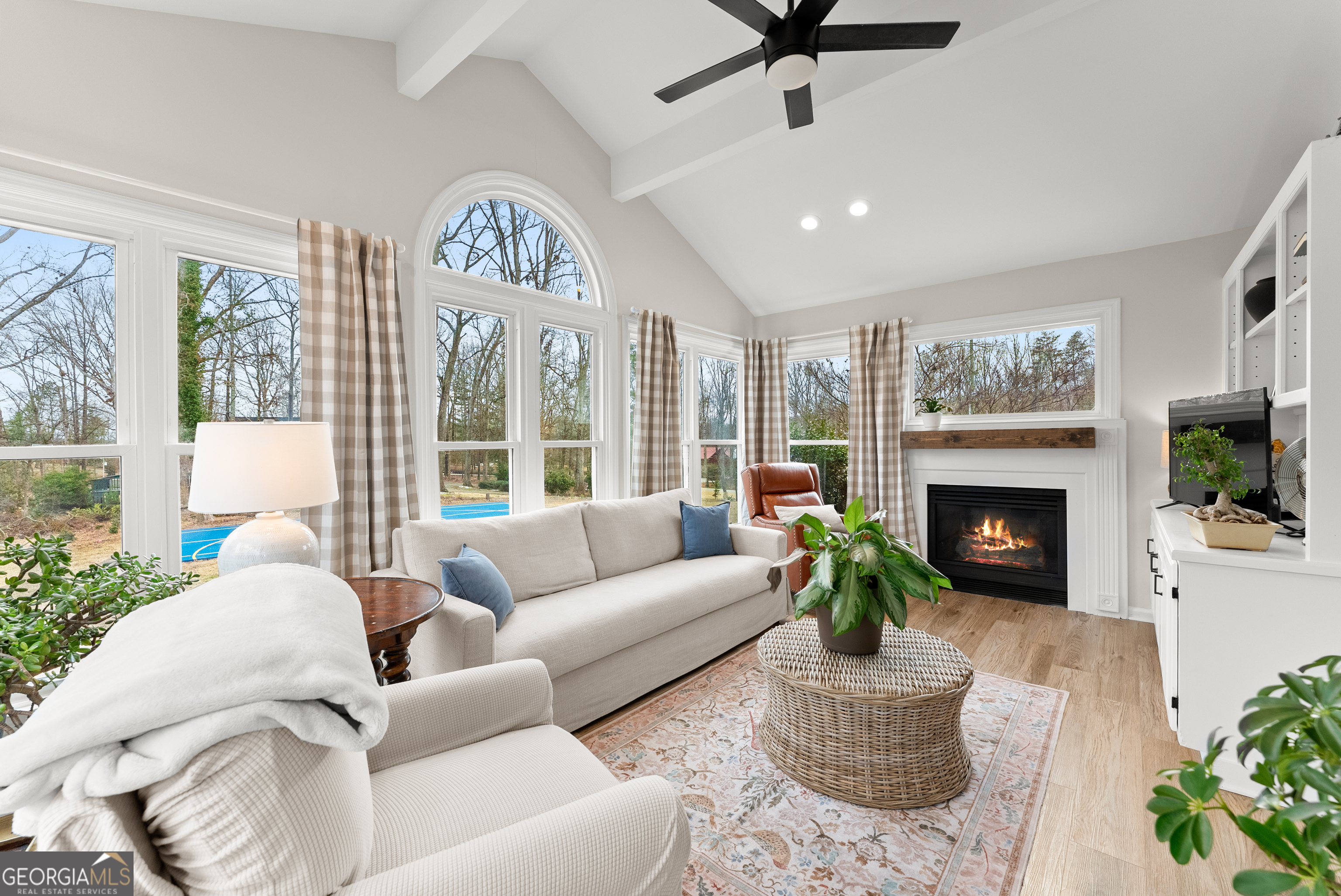 1165 Antioch Campground Road Gainesville, GA 30506 - Photo 15 of 65 a living room with furniture a fireplace and a large window