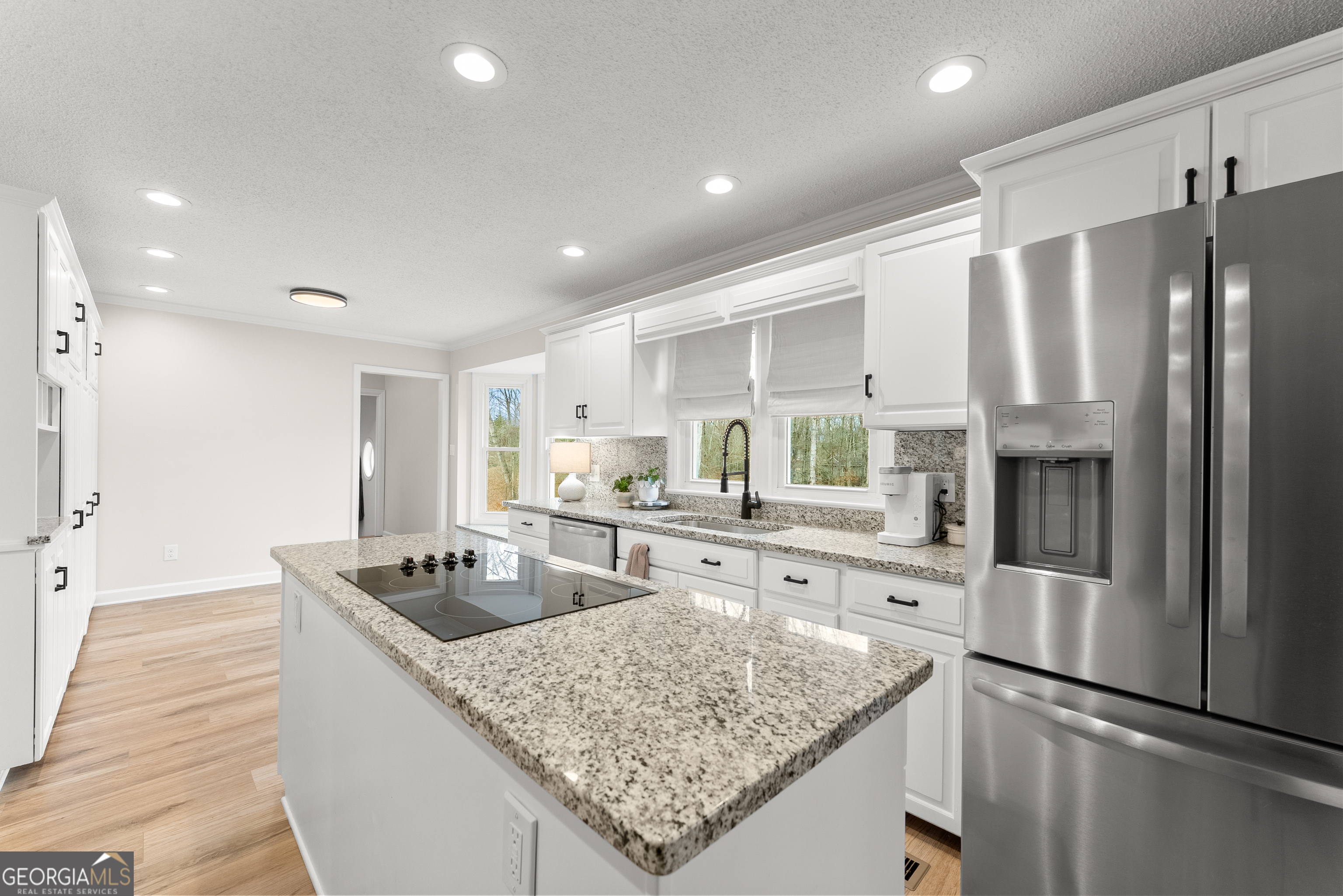1165 Antioch Campground Road Gainesville, GA 30506 - Photo 19 of 65 a kitchen with stainless steel appliances granite countertop refrigerator sink and cabinets