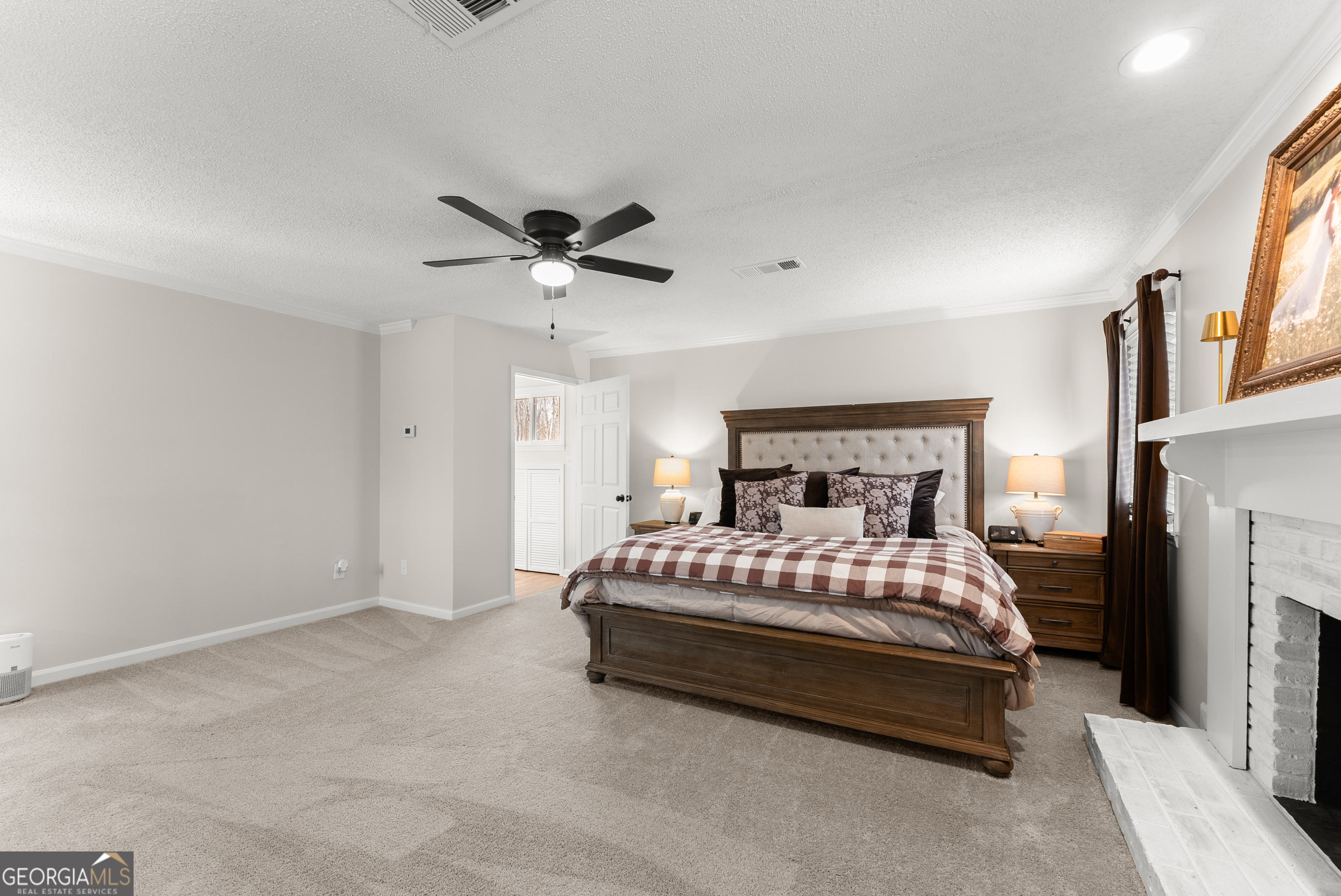 1165 Antioch Campground Road Gainesville, GA 30506 - Photo 33 of 65 a bedroom with a bed and a ceiling fan