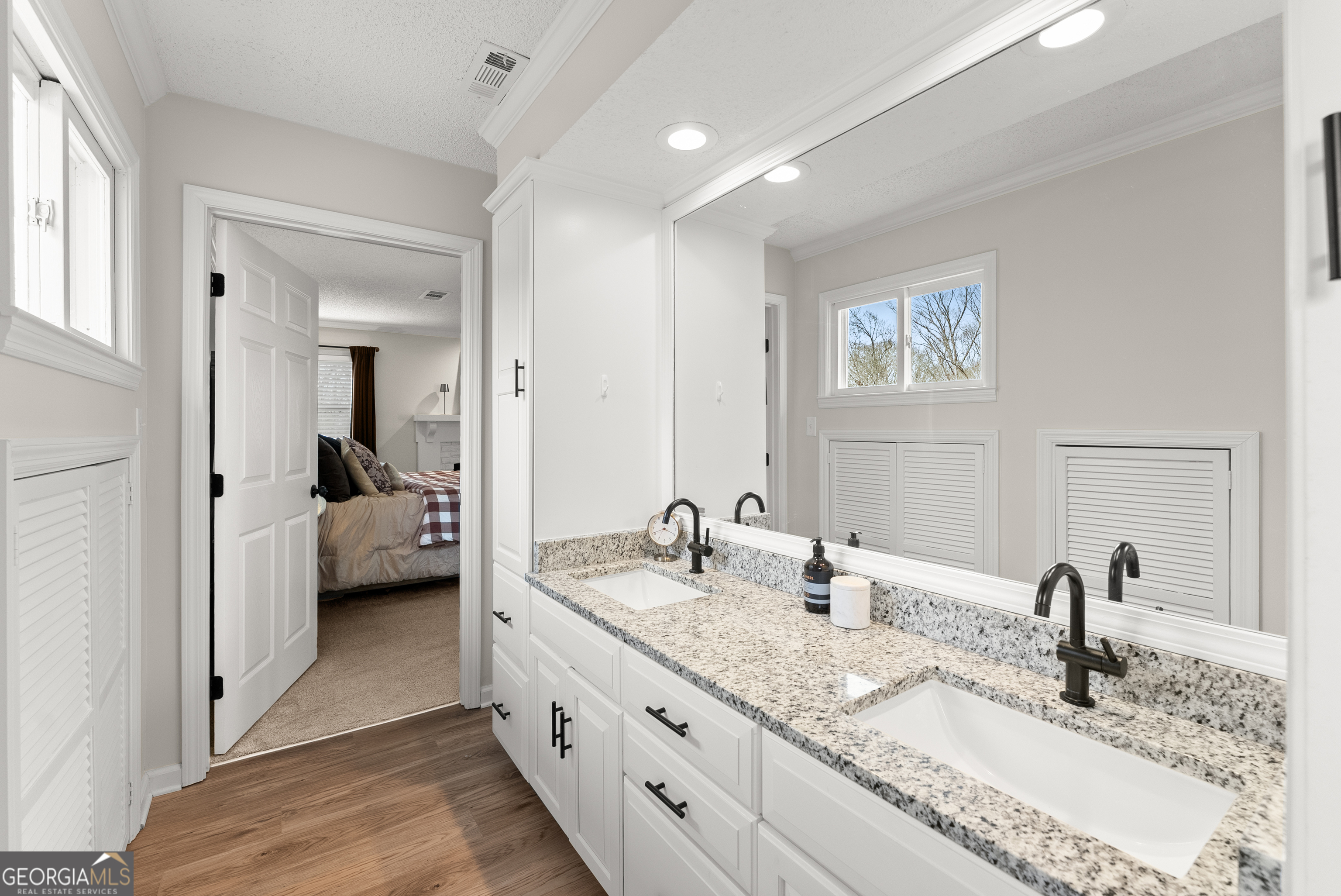 1165 Antioch Campground Road Gainesville, GA 30506 - Photo 36 of 65 a en suite bathroom with double vanity sinks and a mirror