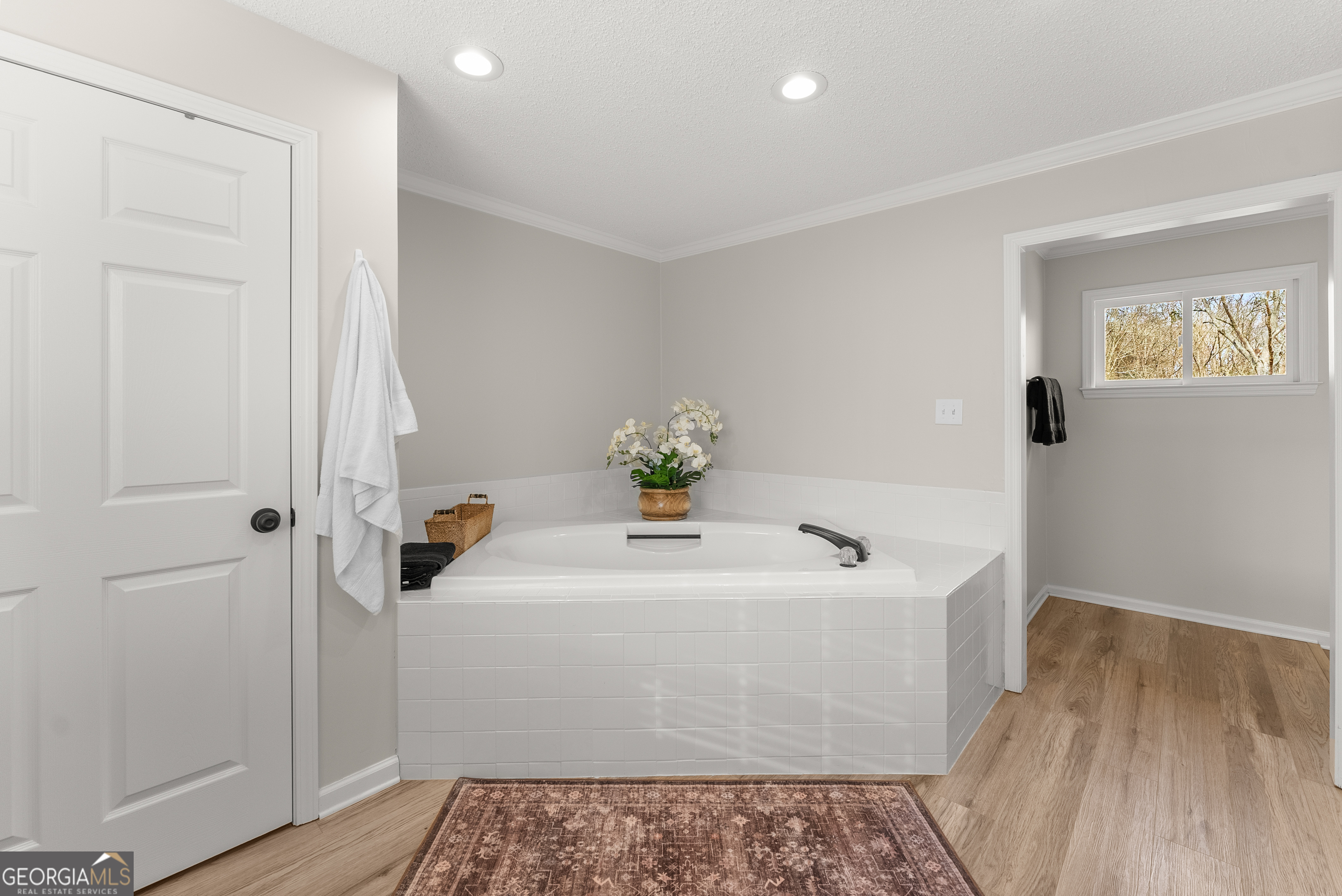 1165 Antioch Campground Road Gainesville, GA 30506 - Photo 40 of 65 a bathroom with a sink a mirror and shower