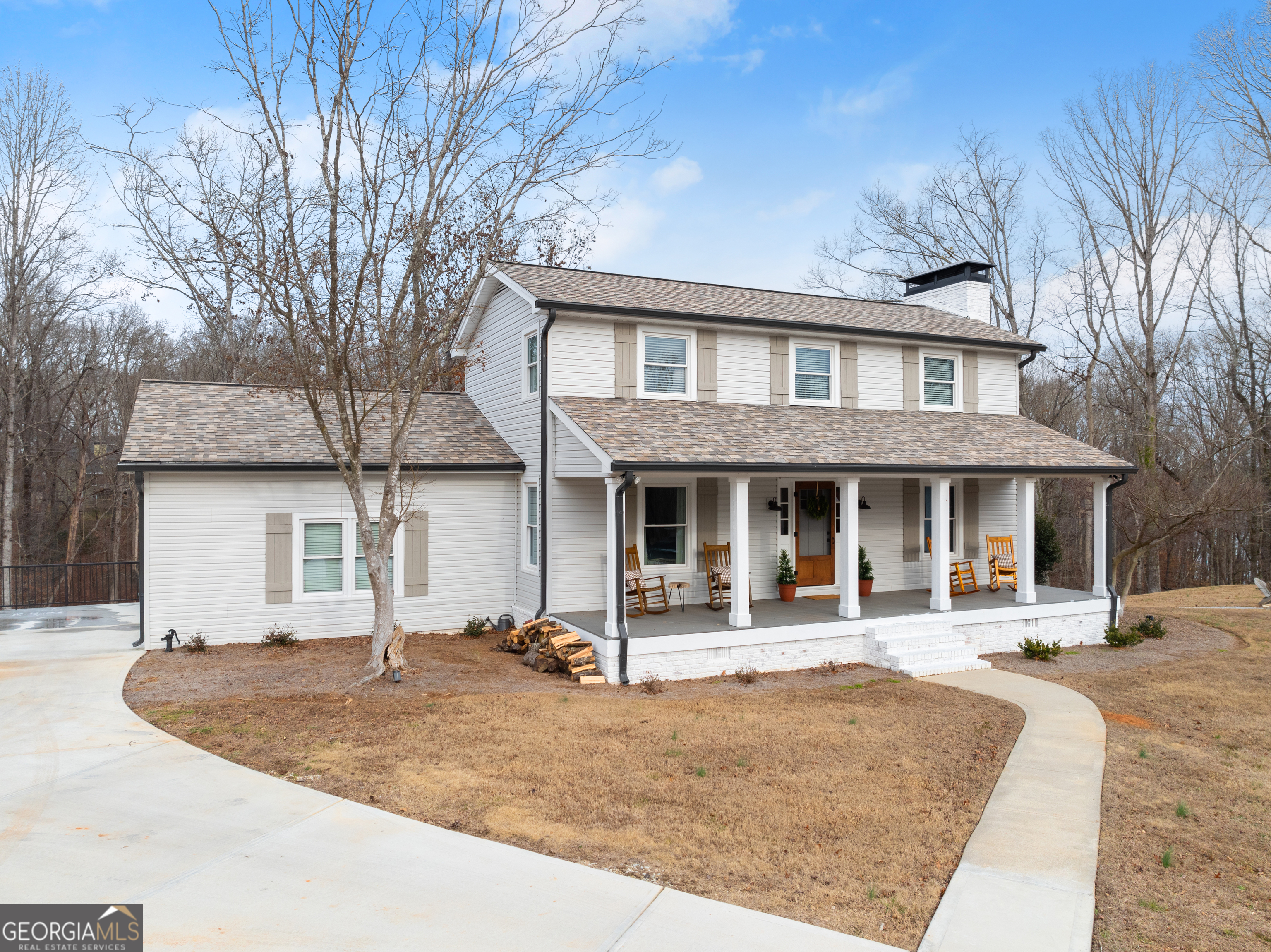1165 Antioch Campground Road Gainesville, GA 30506 - Photo 4 of 65 a front view of a house with yard and trees in the background