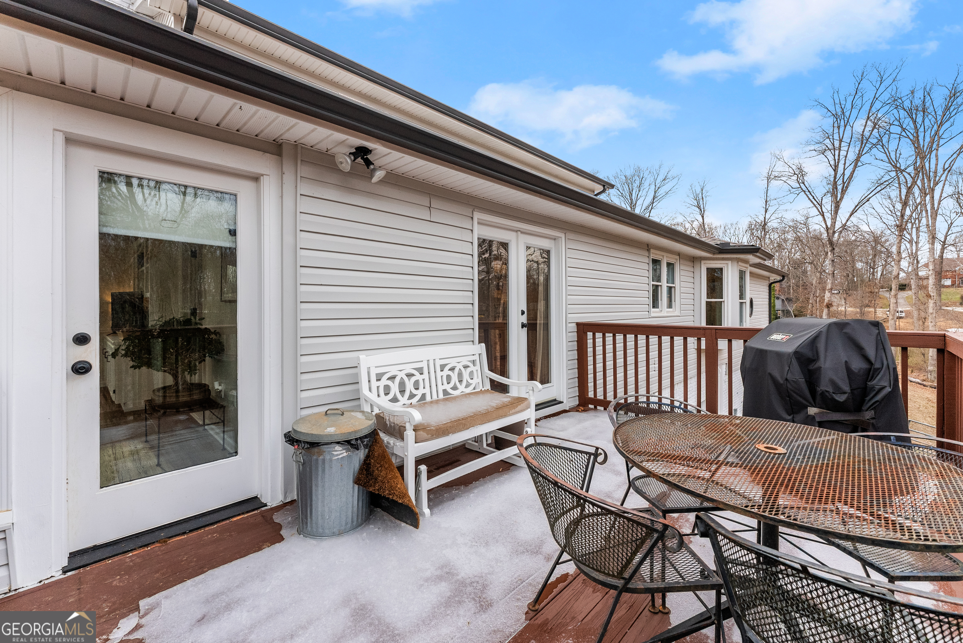 1165 Antioch Campground Road Gainesville, GA 30506 - Photo 50 of 65 a backyard of a house with barbeque oven table and chairs