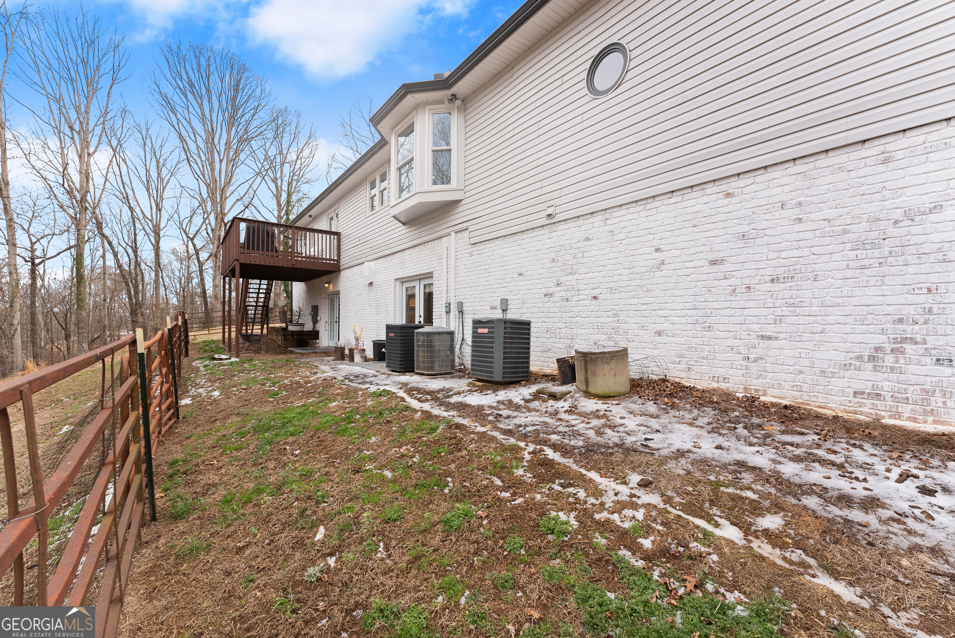 1165 Antioch Campground Road Gainesville, GA 30506 - Photo 52 of 65 a view of a chairs and table in the backyard