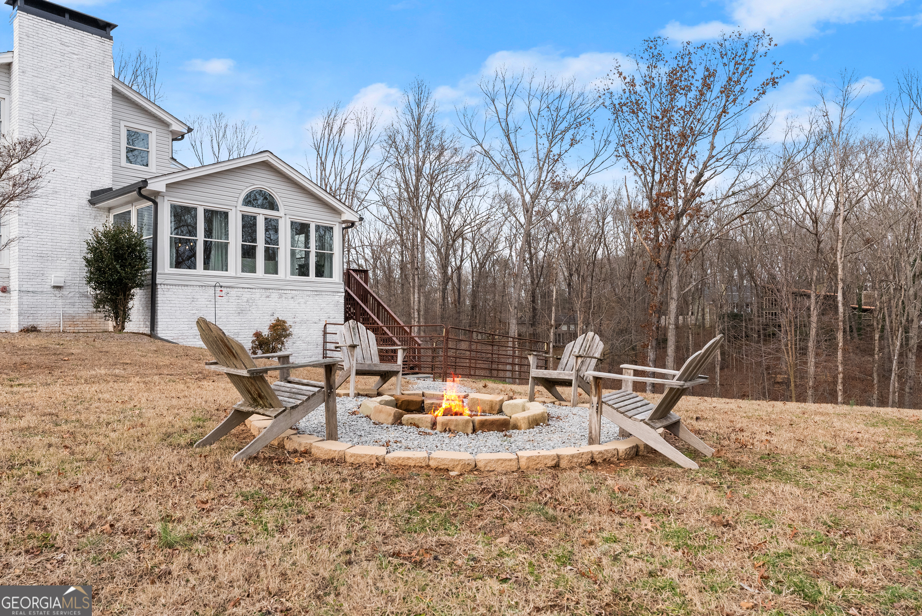 1165 Antioch Campground Road Gainesville, GA 30506 - Photo 56 of 65 a backyard of a house with table and chairs