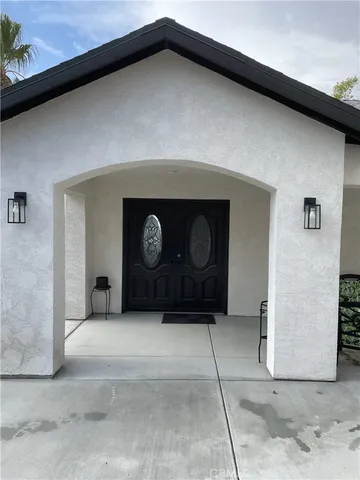 a view of a hallway with paintings on the wall