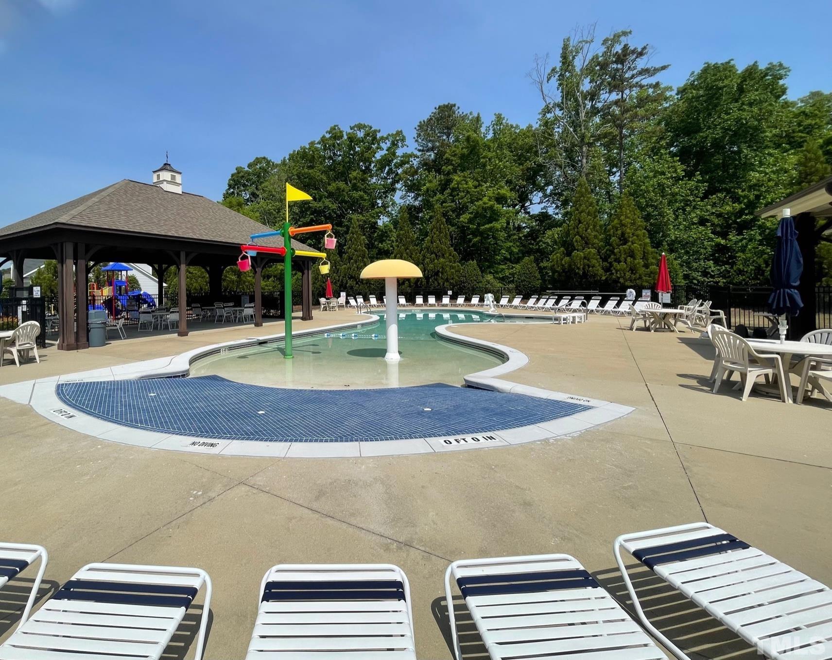 2456 Baslow Drive Apex, NC 27539 - Photo 22 of 39 a view of a swimming pool with a patio