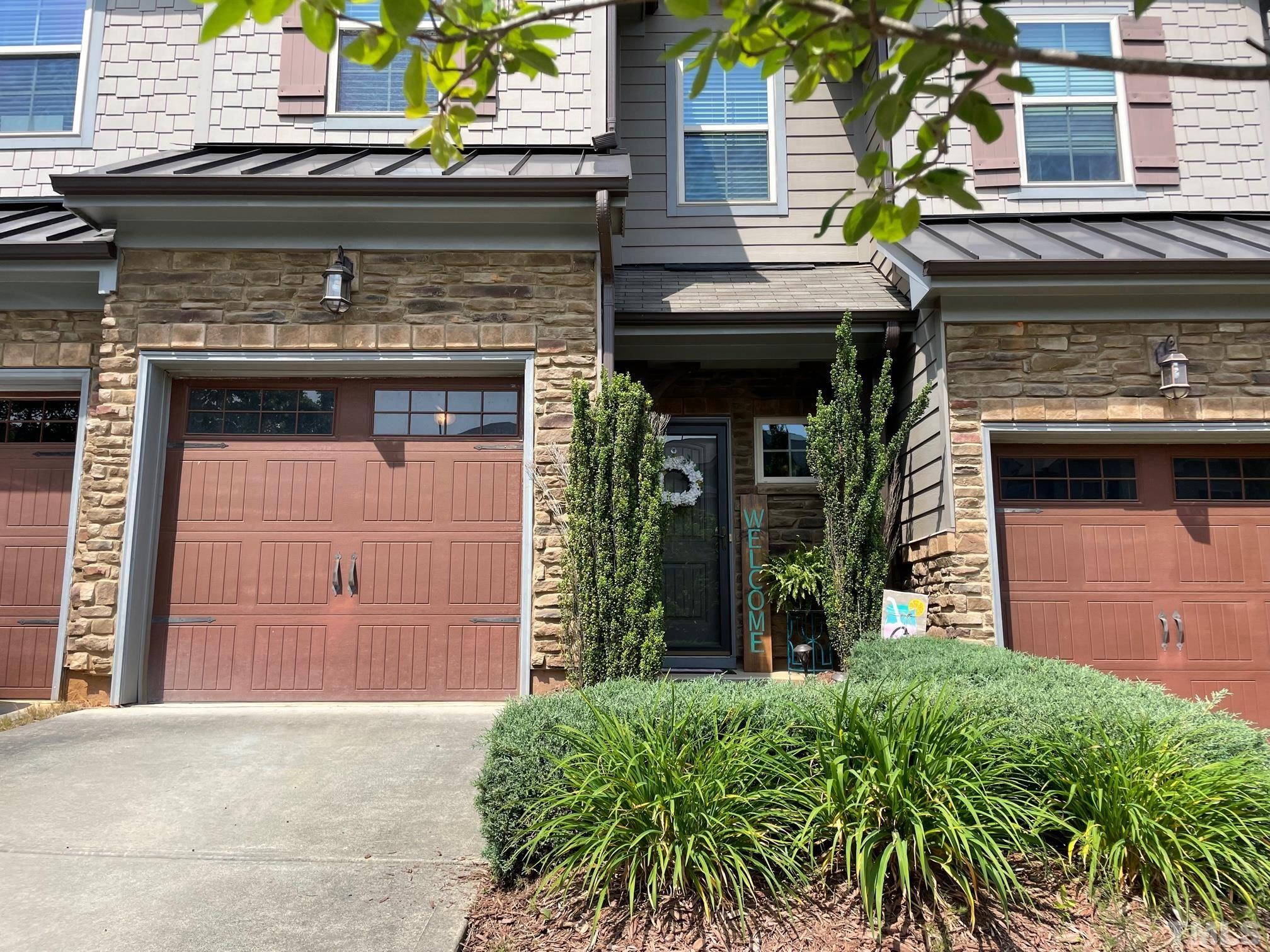 2456 Baslow Drive Apex, NC 27539 - Photo 3 of 39 a front view of a house with garden