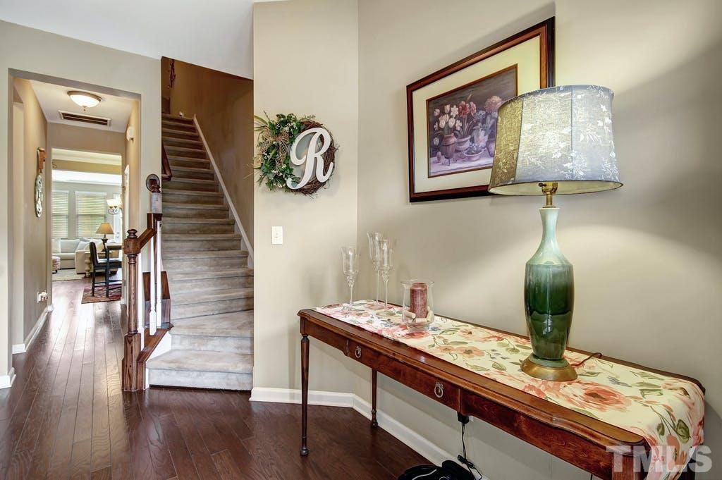 2456 Baslow Drive Apex, NC 27539 - Photo 7 of 39 a room with furniture and wooden floor