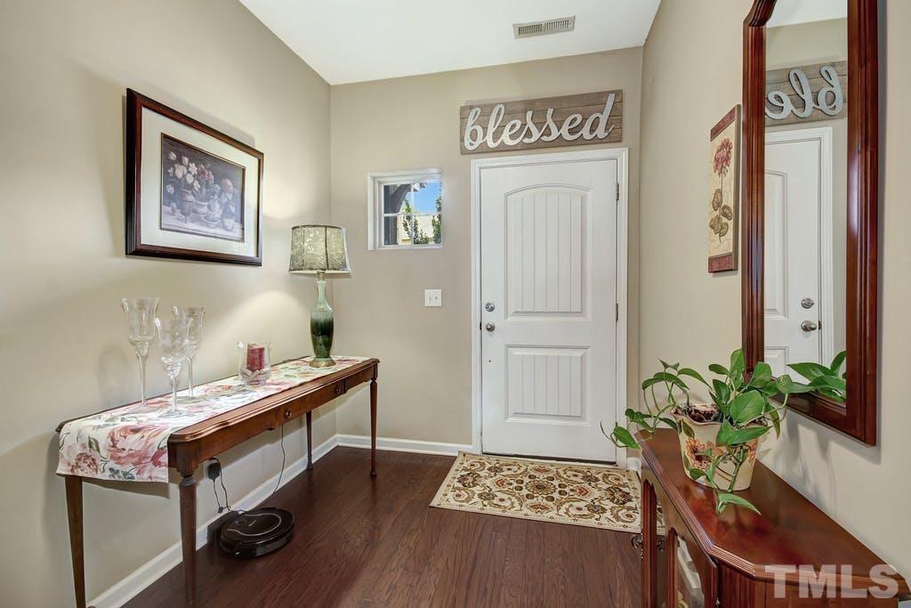 2456 Baslow Drive Apex, NC 27539 - Photo 8 of 39 a reading room with furniture and a potted plant