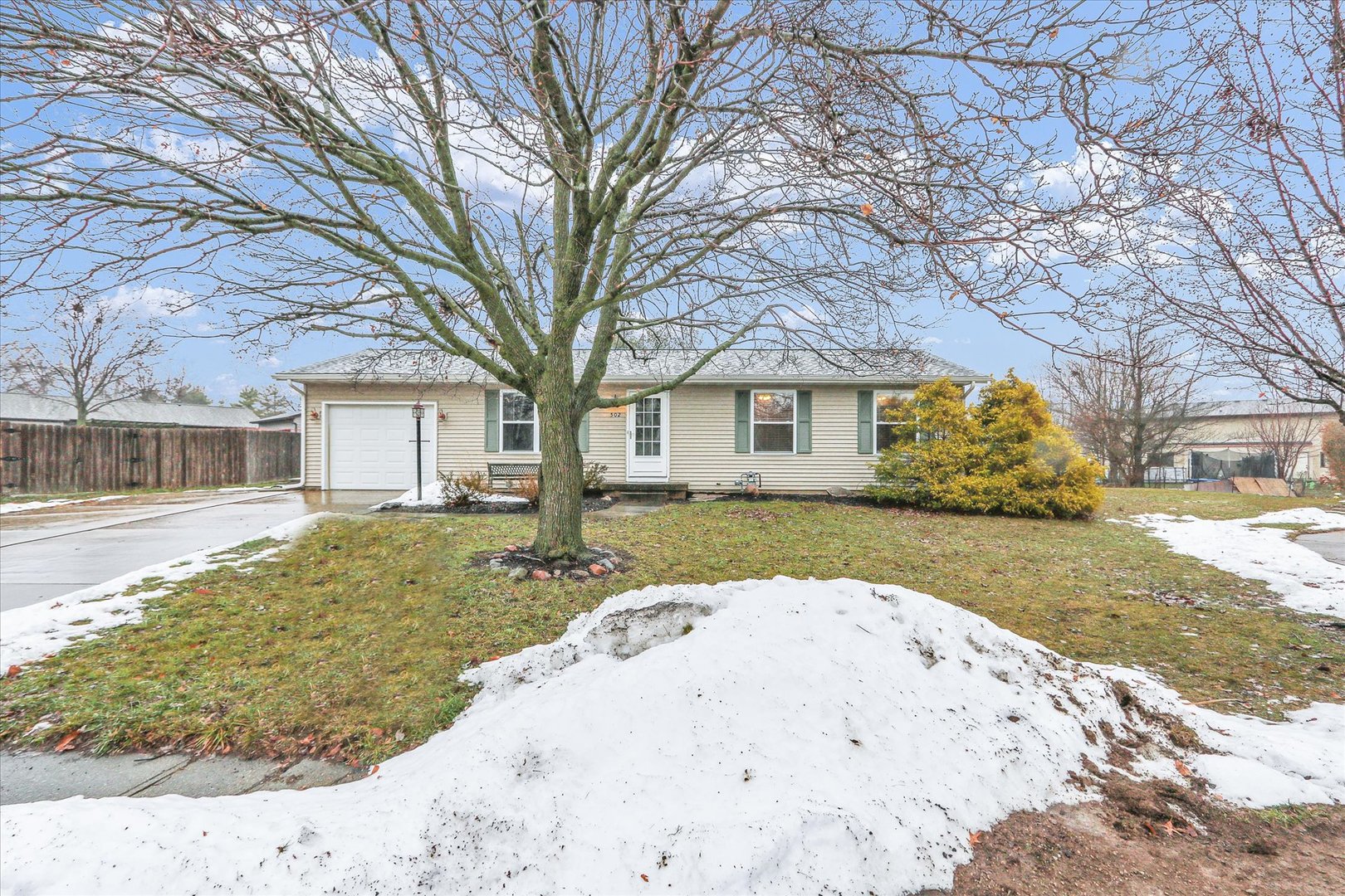 502 Richard Court Mahomet, IL 61853 - Photo 1 of 31 a view of a house with snow on the side of the road