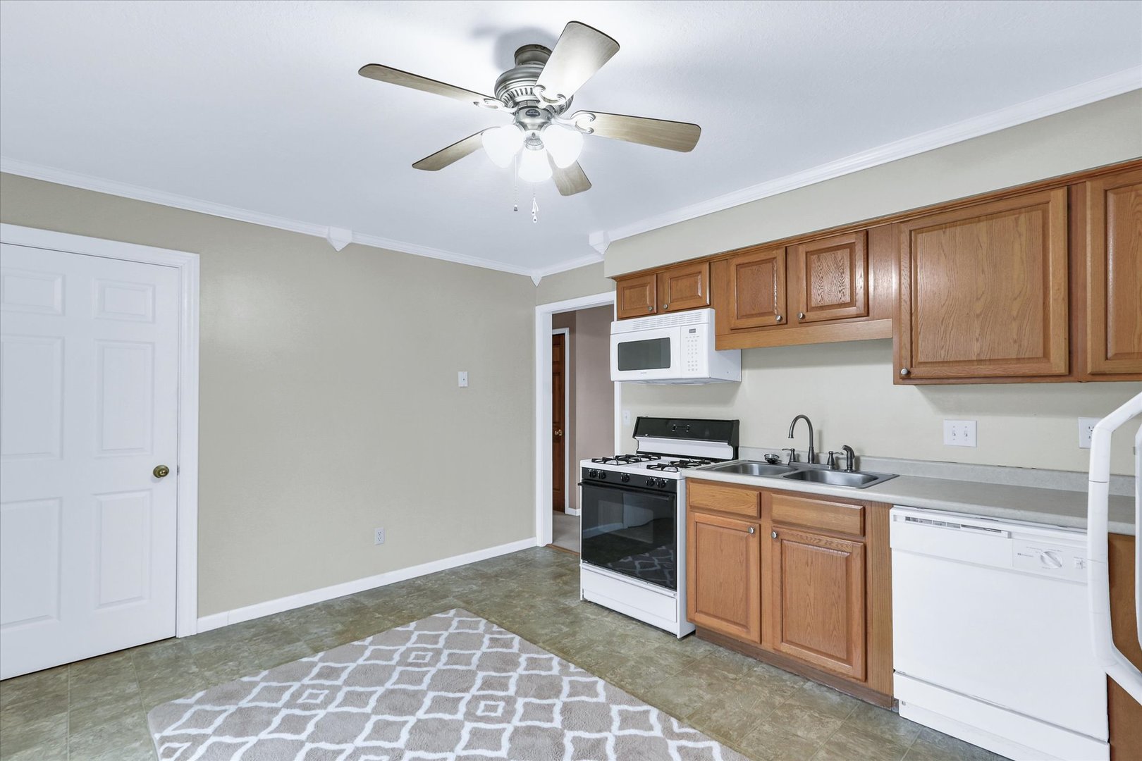 502 Richard Court Mahomet, IL 61853 - Photo 11 of 31 a kitchen with stainless steel appliances granite countertop a sink stove cabinets and refrigerator