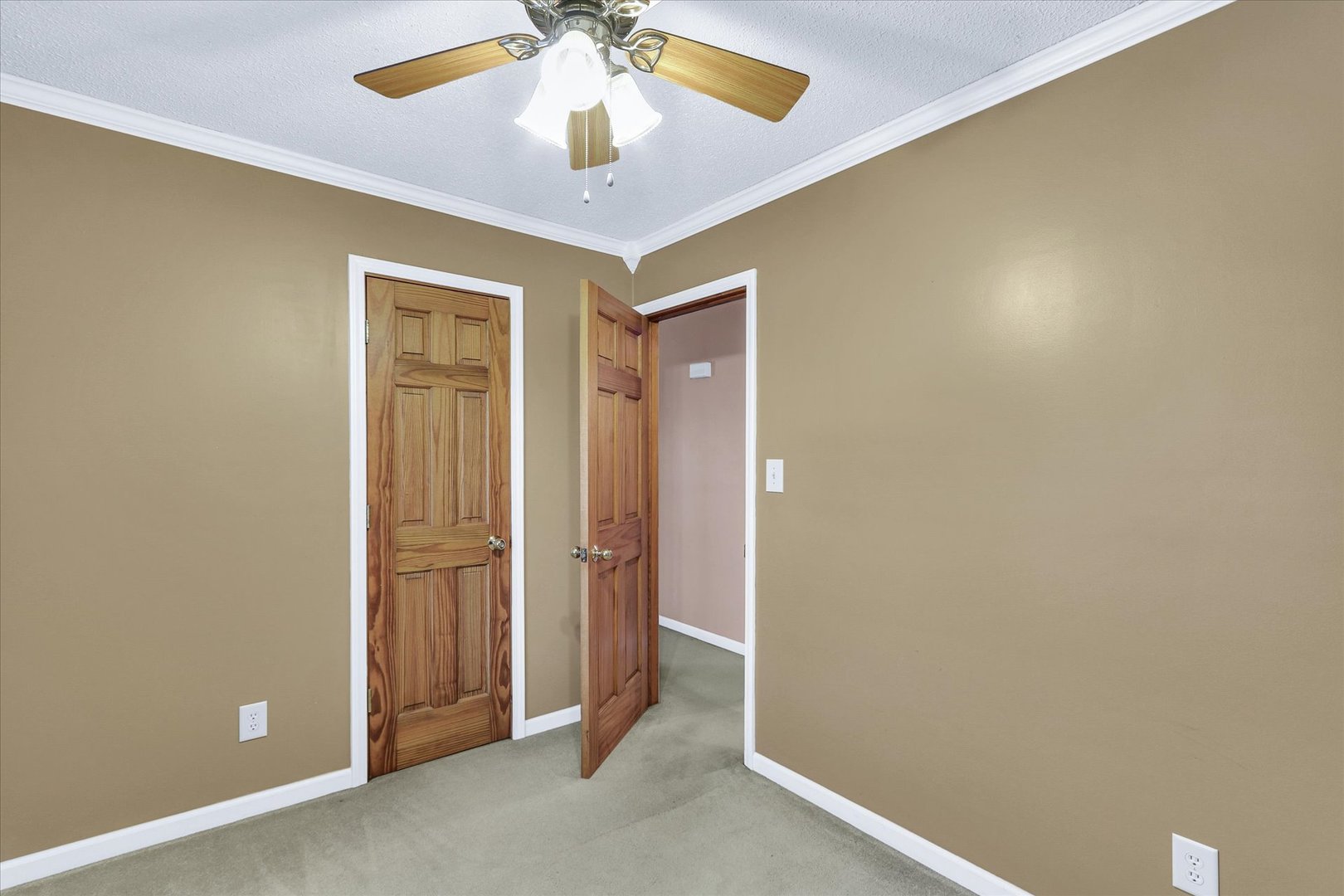 502 Richard Court Mahomet, IL 61853 - Photo 19 of 31 an empty room with a chandelier fan