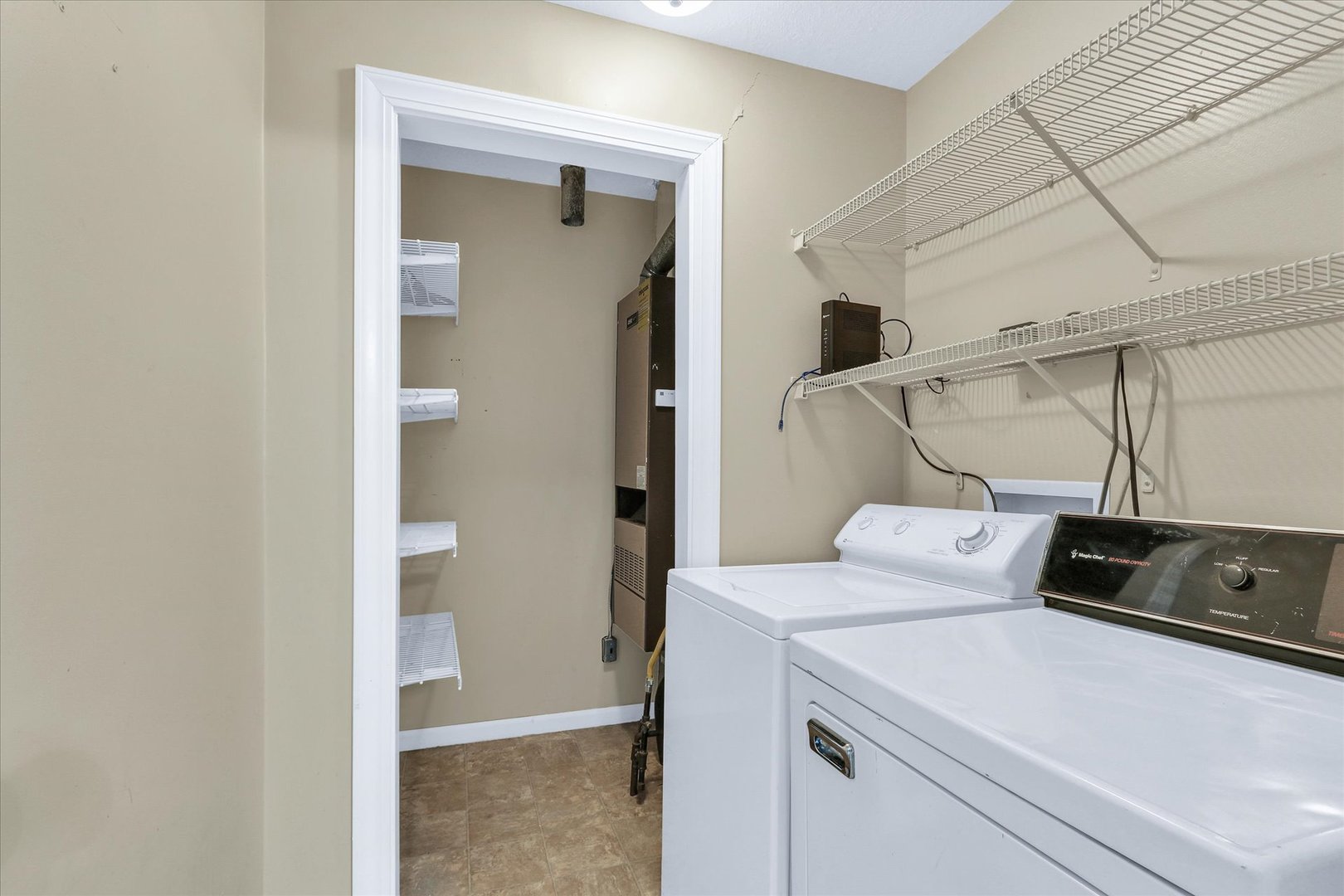 502 Richard Court Mahomet, IL 61853 - Photo 20 of 31 a view of storage and utility room with washer and dryer