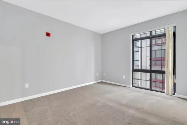 a view of an empty room with a window