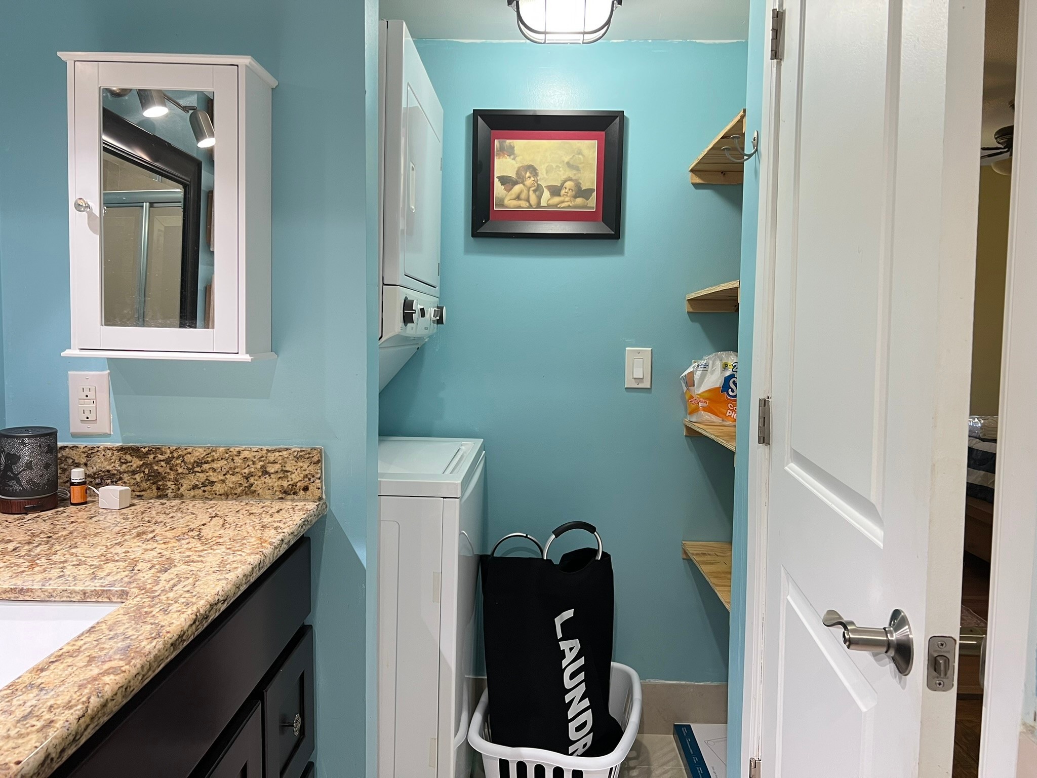 2230 South Piney Point Road, Unit 219 Houston, TX 77063 - Photo 11 of 15 a bathroom with a granite countertop sink and a mirror