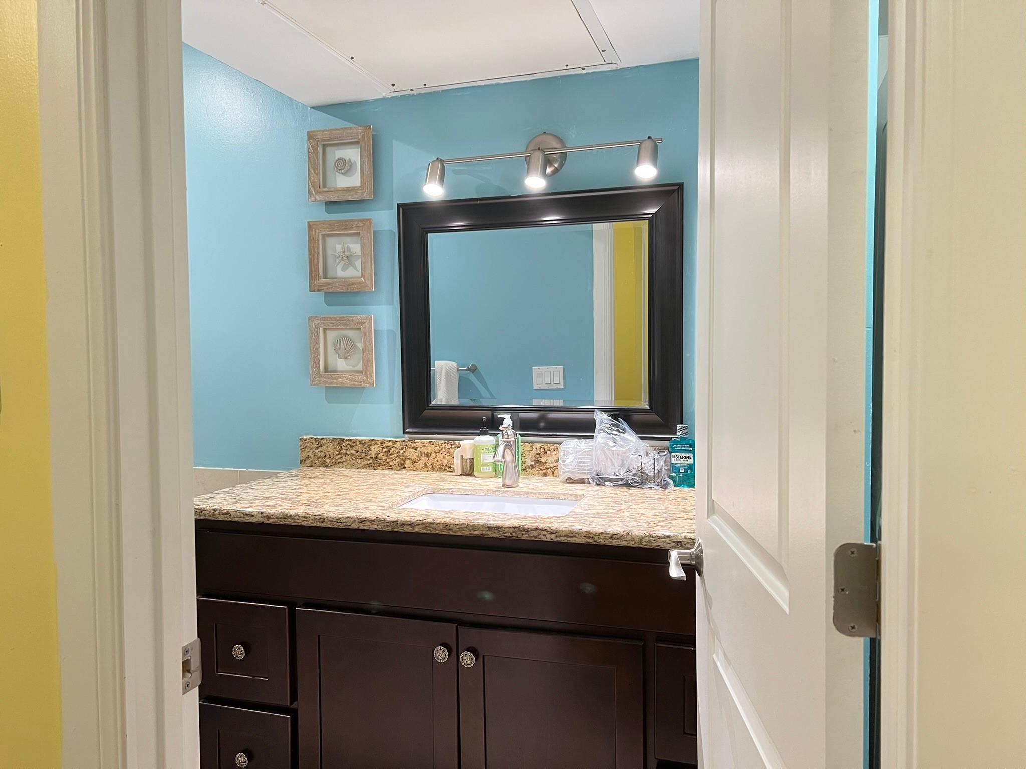 2230 South Piney Point Road, Unit 219 Houston, TX 77063 - Photo 9 of 15 a bathroom with a sink and a mirror