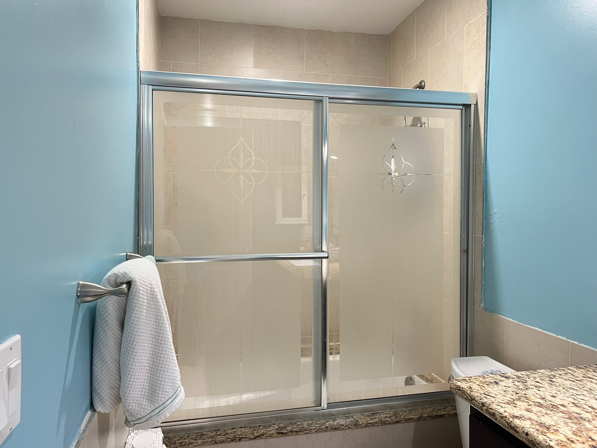 2230 South Piney Point Road, Unit 219 Houston, TX 77063 - Photo 10 of 15 a bathroom with a glass shower door