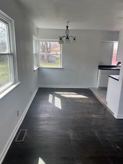 4203 East 12th Place Gary, IN 46403 - Photo 4 of 15 a view of empty room with wooden floor and fan