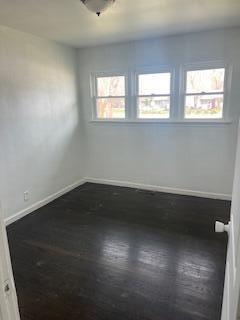 4203 East 12th Place Gary, IN 46403 - Photo 7 of 15 an empty room with wooden floor and windows