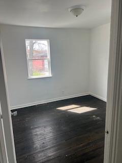 4203 East 12th Place Gary, IN 46403 - Photo 10 of 15 a view of an empty room with wooden floor and a window