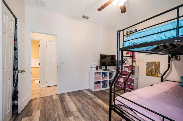 a bedroom with furniture and a window