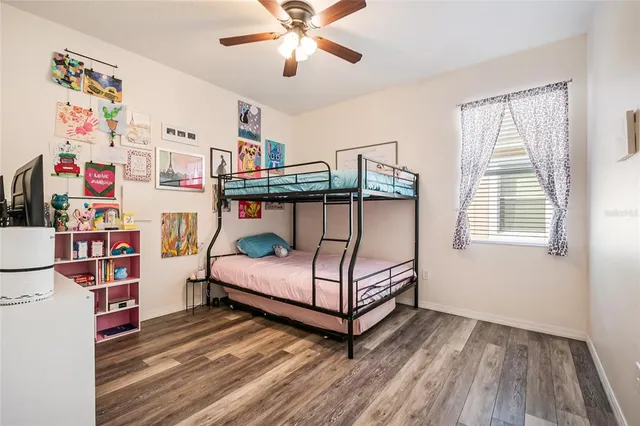 a bedroom with furniture and a window