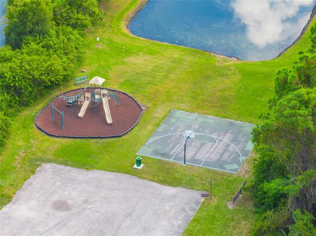 a view of a swimming pool with a yard