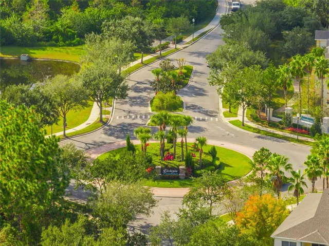 a view of a swimming pool with a yard and lake view