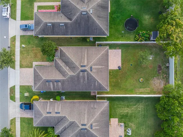 an aerial view of a house with a garden