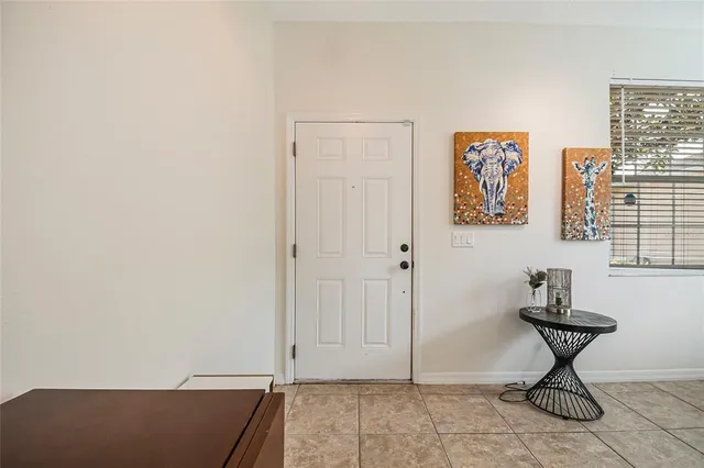 a view of room with window and wooden floor
