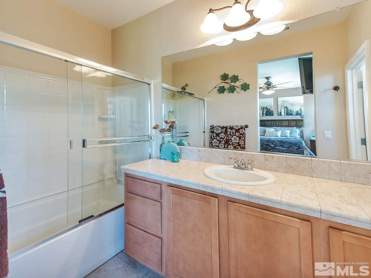 2194 Stanton Lane Reno, NV 89502 - Photo 12 of 18 a bathroom with a sink and a mirror