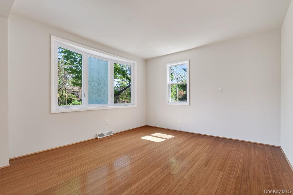 6 Winterberry Road Fishkill, NY 12524 - Photo 8 of 43 Spacious room featuring wood-finish flooring and a bay window