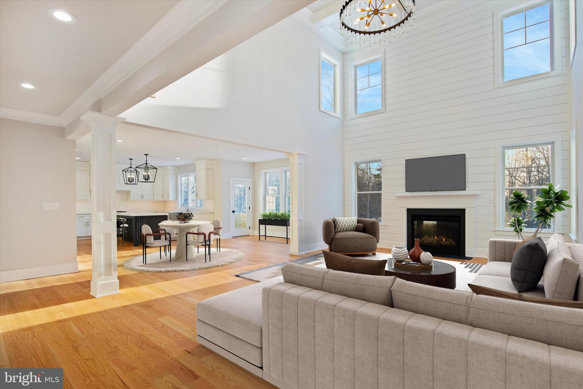 825 A Morris Road Lansdale, PA 19446 - Photo 19 of 20 a living room with furniture a fireplace and a dining table with wooden floor
