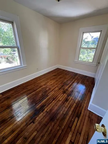 a view of wooden floor in an empty room