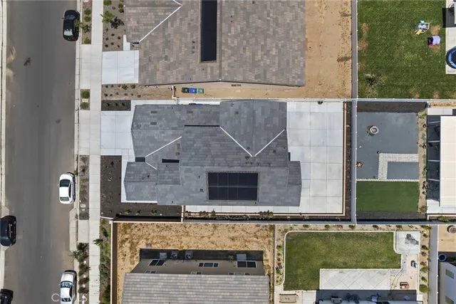 an aerial view of a house with a swimming pool