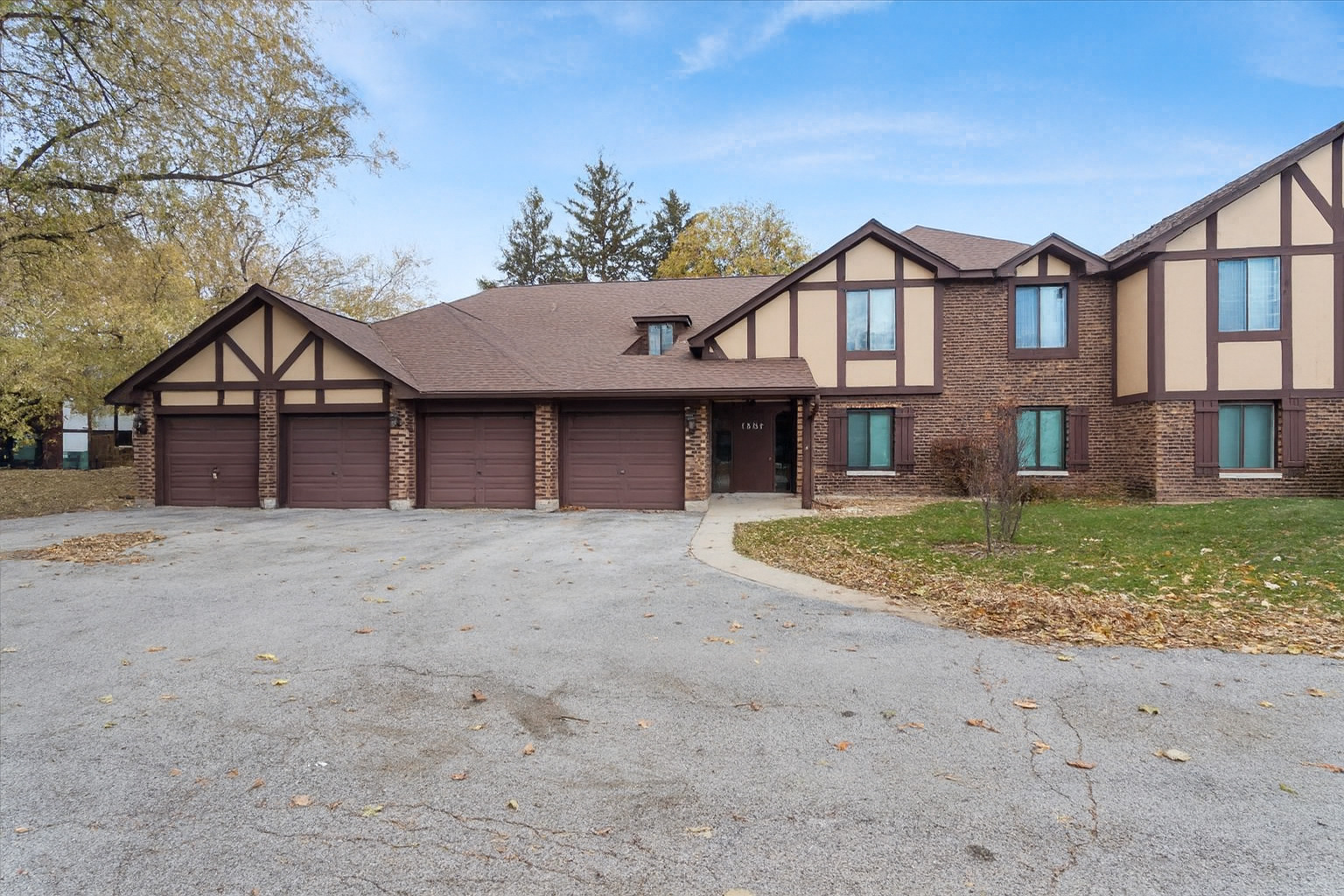 1601 Thames Court, Unit A Wheaton, IL 60189 - Photo 1 of 21 a front view of a house with garden