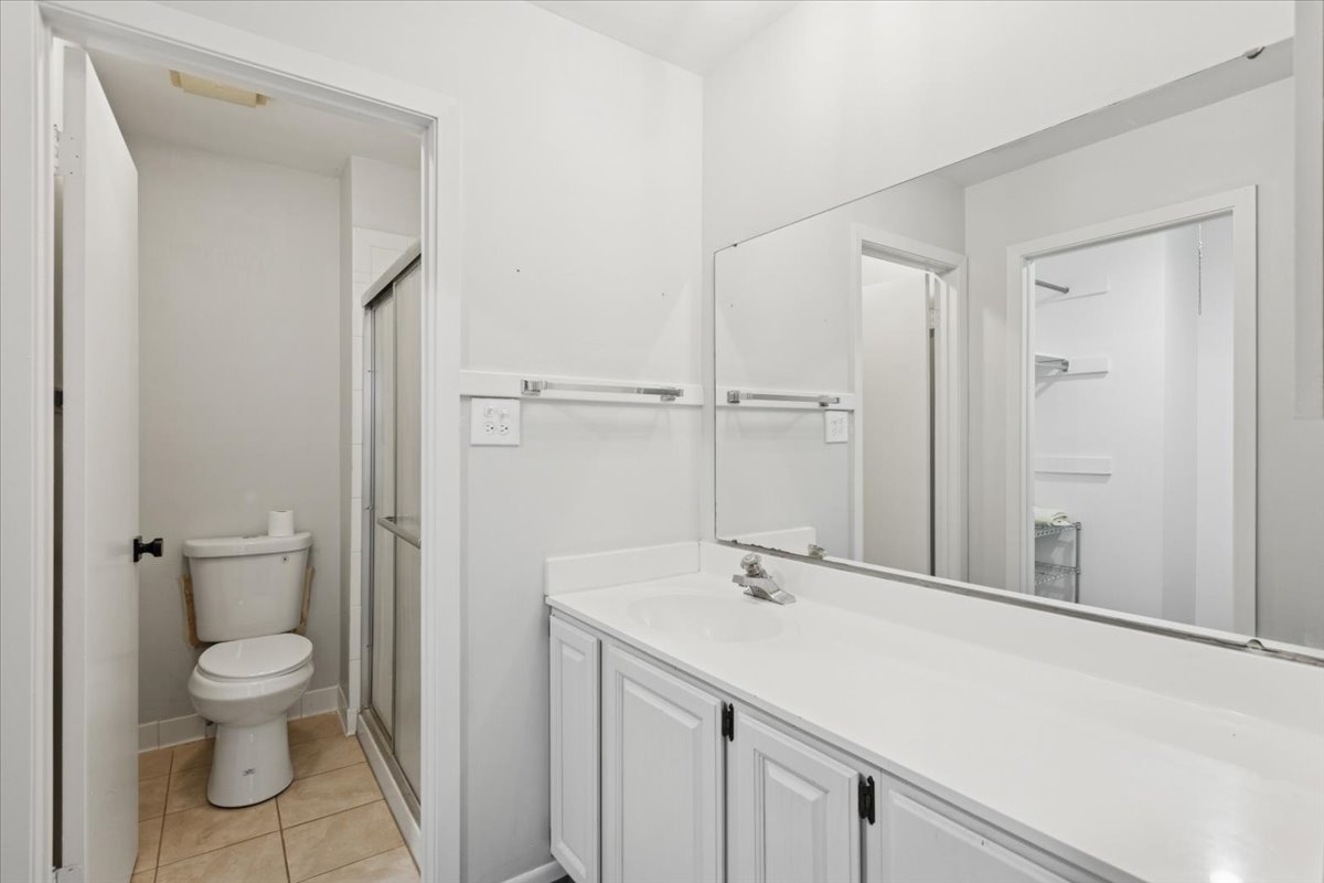 1601 Thames Court, Unit A Wheaton, IL 60189 - Photo 11 of 21 a bathroom with a sink toilet and vanity