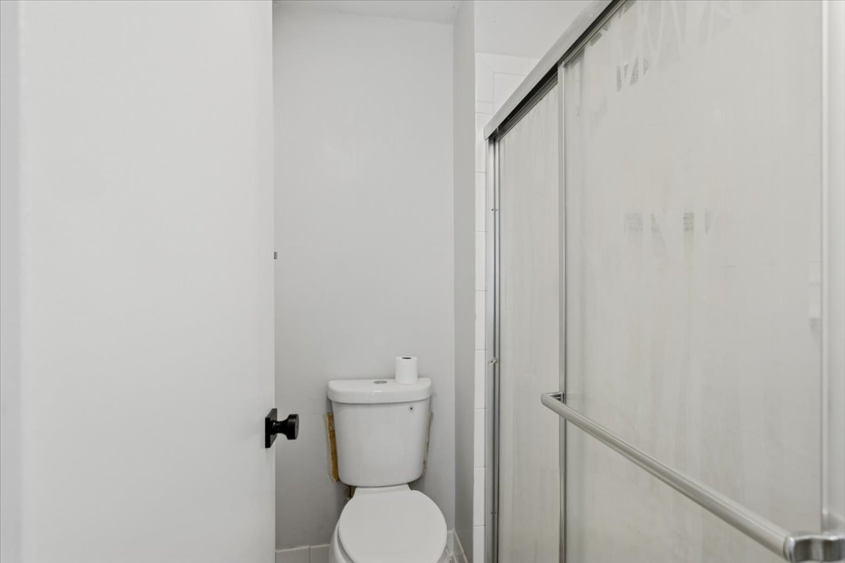 1601 Thames Court, Unit A Wheaton, IL 60189 - Photo 12 of 21 a white toilet sitting next to a white wall