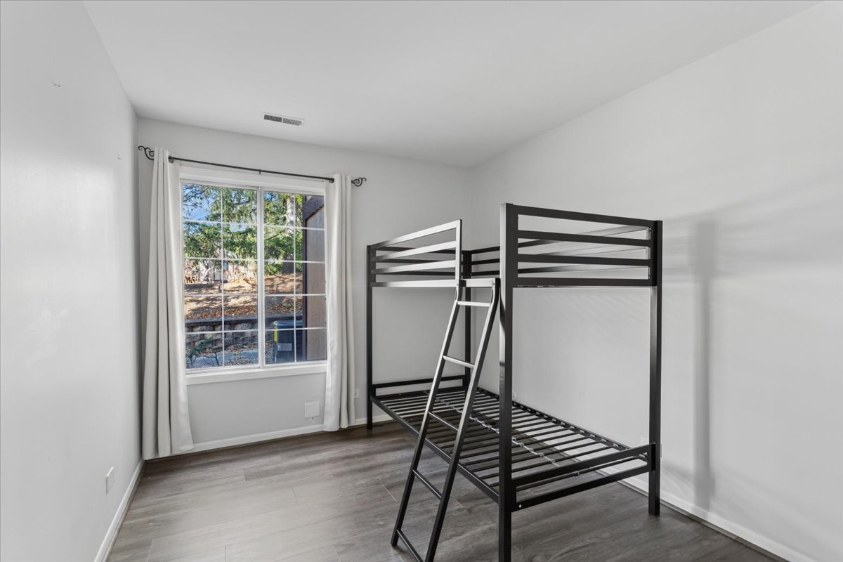 1601 Thames Court, Unit A Wheaton, IL 60189 - Photo 15 of 21 a very nice looking room with wooden floor and a window