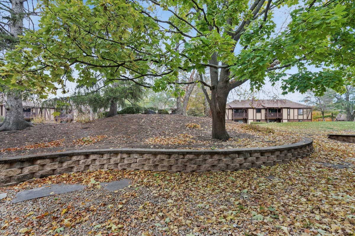 1601 Thames Court, Unit A Wheaton, IL 60189 - Photo 20 of 21 a front view of a house with garden