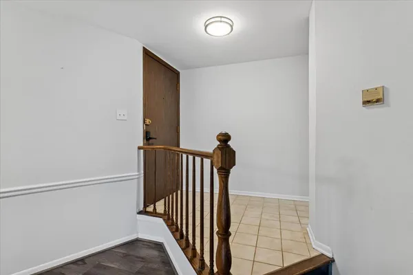 a view of a hallway with a door