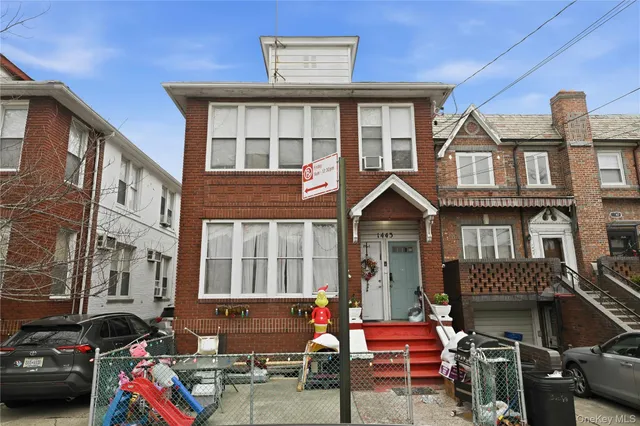 a front view of a building with many windows