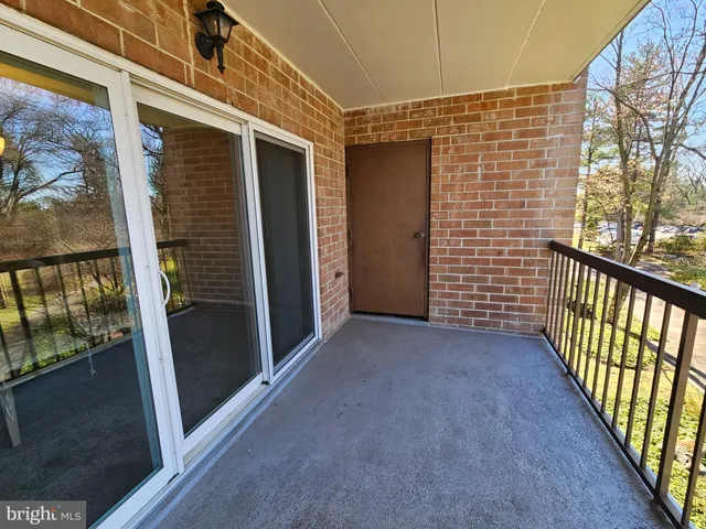 a view of a porch with wooden floor