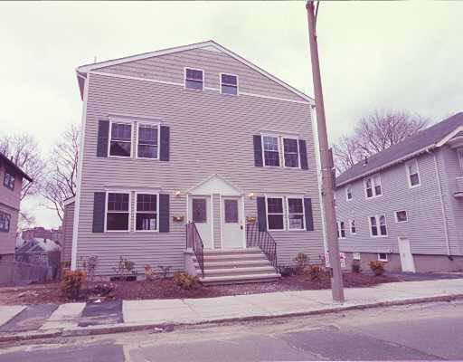 174 Calumet Street, Unit 1 Boston, MA 02120 - Photo 1 of 1 a front view of a house with a yard
