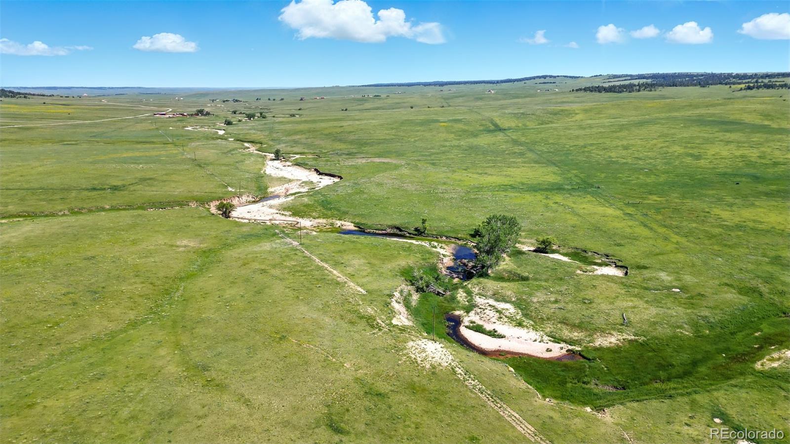 91 Parcel County Road, Unit 4 Ramah, CO 80832 - Photo 14 of 27 a view of an ocean and a yard