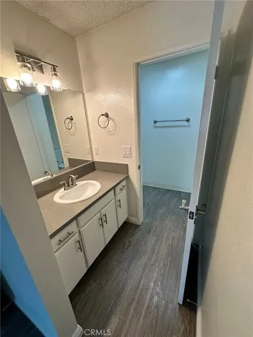 a bathroom with a sink mirror and vanity